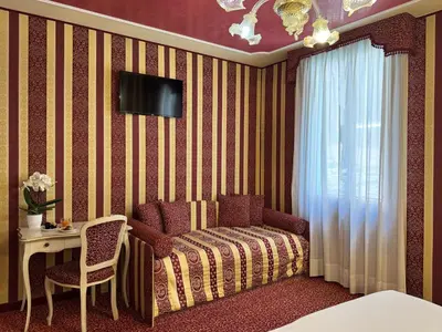Letto o letti in una camera di Hotel Alcyone