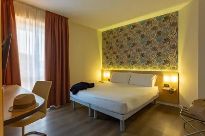 Letto o letti in una camera di Hotel Ambra