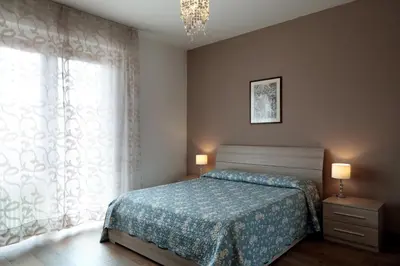 Letto o letti in una camera di PadovaResidence Apartments - vicino Cappella degli Scrovegni, Ospedale e Università