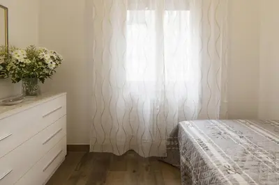 Letto o letti in una camera di PadovaResidence Apartments - vicino Cappella degli Scrovegni, Ospedale e Università