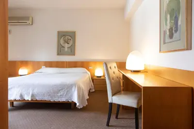 Letto o letti in una camera di Hotel Due Mori