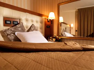 Letto o letti in una camera di Hotel Ariston