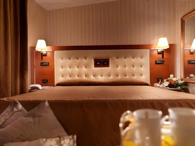 Letto o letti in una camera di Hotel Ariston
