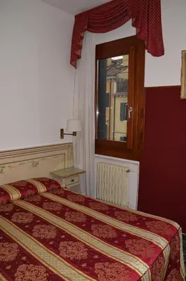 Letto o letti in una camera di Albergo Basilea