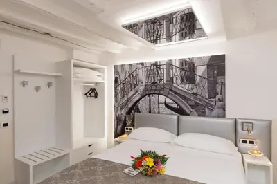 Letto o letti in una camera di UNAHOTELS Ala Venezia-Adults 16