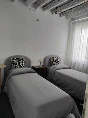 Letto o letti in una camera di Ada Canal House VISTA CANALE