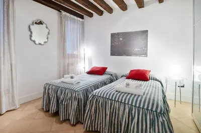 Letto o letti in una camera di Riva Di Biasio & Sestiere Santa Croce x4