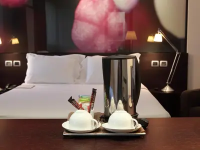 Letto o letti in una camera di Postumia Hotel Design