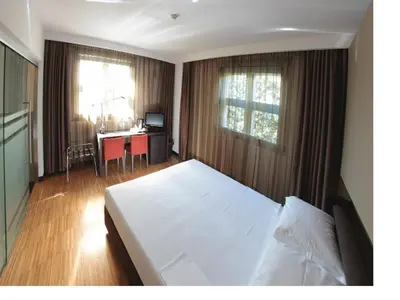 Letto o letti in una camera di Postumia Hotel Design