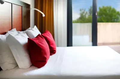 Letto o letti in una camera di Hotel Holiday La Marca