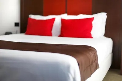 Letto o letti in una camera di Hotel Holiday La Marca