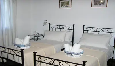 Letto o letti in una camera di B&B Villa Trotter