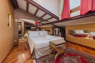 Letto o letti in una camera di Cà dell'arte Suite