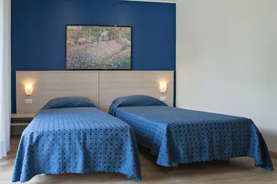 Letto o letti in una camera di Hotel Garibaldi