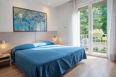 Letto o letti in una camera di Hotel Garibaldi