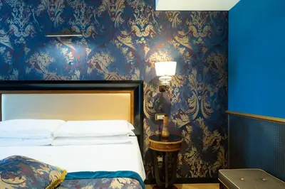 Letto o letti in una camera di Hotel Paganelli