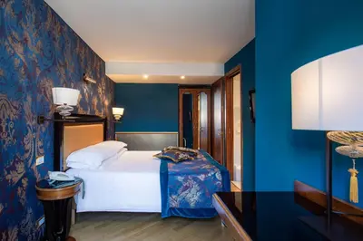 Letto o letti in una camera di Hotel Paganelli