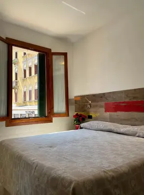 Letto o letti in una camera di Hotel San Geremia