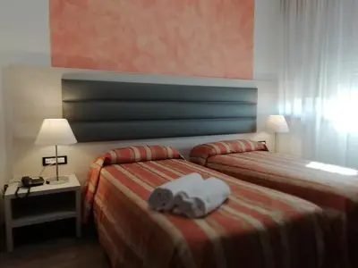 Letto o letti in una camera di Hotel Kristall
