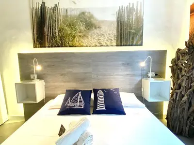 Letto o letti in una camera di Civico 148- Lido di Jesolo - Per Famiglie