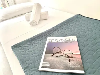 Letto o letti in una camera di Civico 148- Lido di Jesolo - Per Famiglie