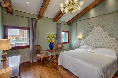 Letto o letti in una camera di Hotel Santa Chiara