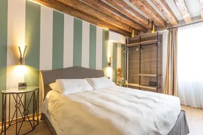 Letto o letti in una camera di Hotel Tiziano