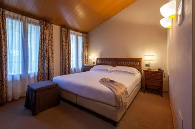Letto o letti in una camera di Hotel Canon d'Oro