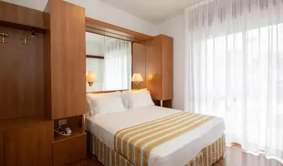 Letto o letti in una camera di Hotel Imperia