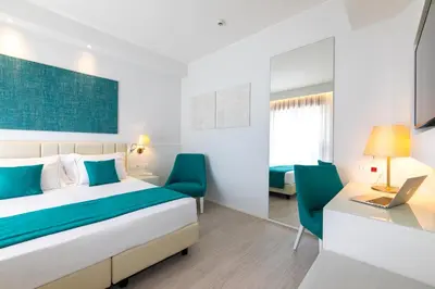 Letto o letti in una camera di Hotel Imperia