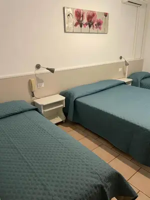 Letto o letti in una camera di Hotel Garni Tosca