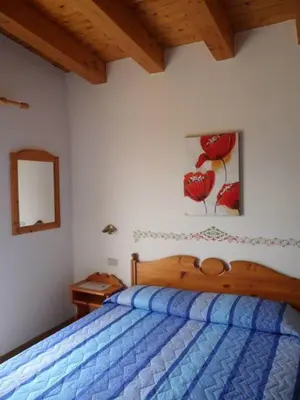 Letto o letti in una camera di Hotel Garni Tosca