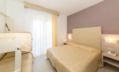 Letto o letti in una camera di Hotel Torino