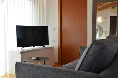 TV o dispositivi per l'intrattenimento presso Golf Jesolo Village ➔ Attico con Piscina