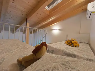 Letto o letti in una camera di La Quercia