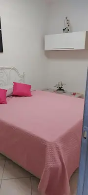 Letto o letti in una camera di APPARTAMENTO IN SOTTOMARINA DI CHIOGGIA
