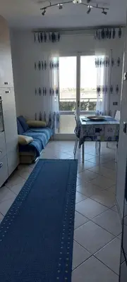Letto o letti in una camera di APPARTAMENTO IN SOTTOMARINA DI CHIOGGIA