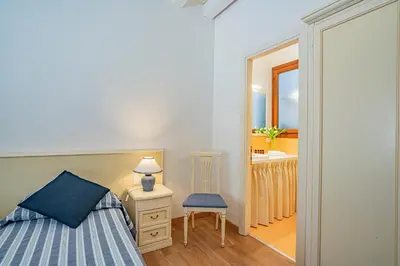 Letto o letti in una camera di Ca' Dei Musicanti 1 Few Steps from Rialto Bridge!