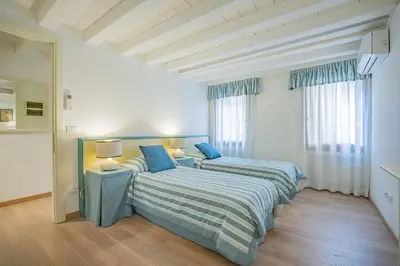 Letto o letti in una camera di Ca' Dei Musicanti 2 Few Steps from Rialto Bridge!