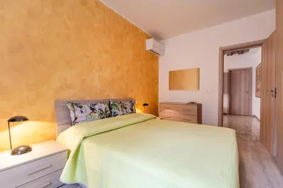 Letto o letti in una camera di Ponte Squero Flat M0270423226