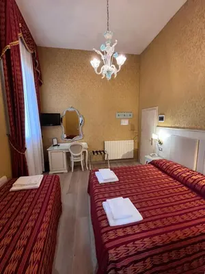 Letto o letti in una camera di Hotel Castello