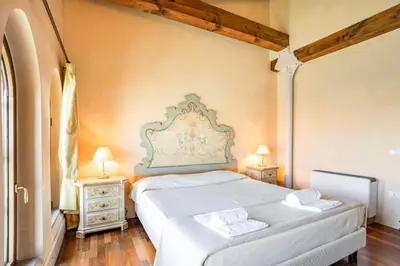 Letto o letti in una camera di Molino Stucky Residence Suites II