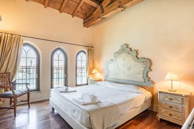 Letto o letti in una camera di Molino Stucky Residence Suites II