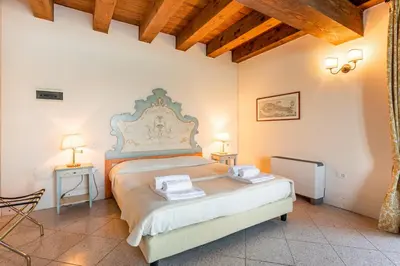 Letto o letti in una camera di Molino Stucky Residence Burchio Suite