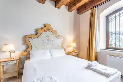 Letto o letti in una camera di Molino Stucky Residence Burchiello Suite