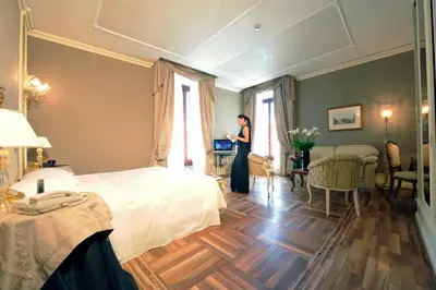 Letto o letti in una camera di Ca' Sagredo Hotel
