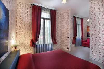 Letto o letti in una camera di Hotel Atlanta Augustus