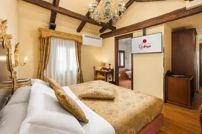 Letto o letti in una camera di Hotel Ca' Alvise