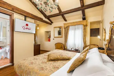 Letto o letti in una camera di Hotel Ca' Alvise