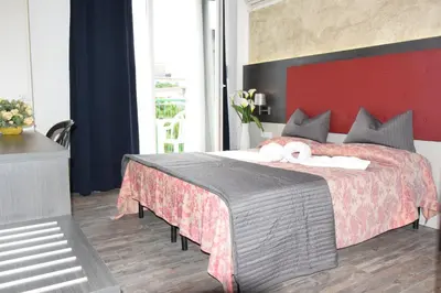 Letto o letti in una camera di Hotel Verdi